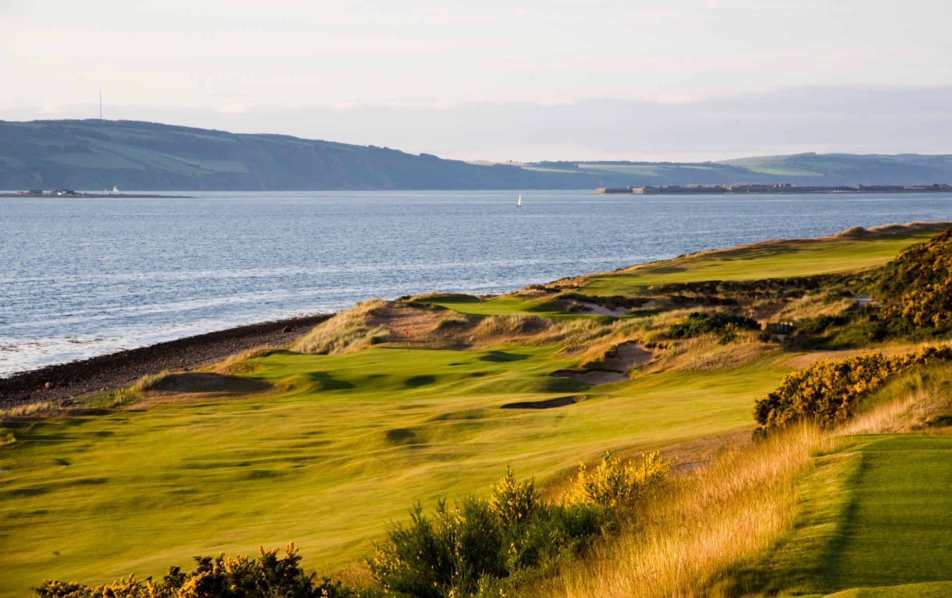 View of the maincured greens running besides the coastal line