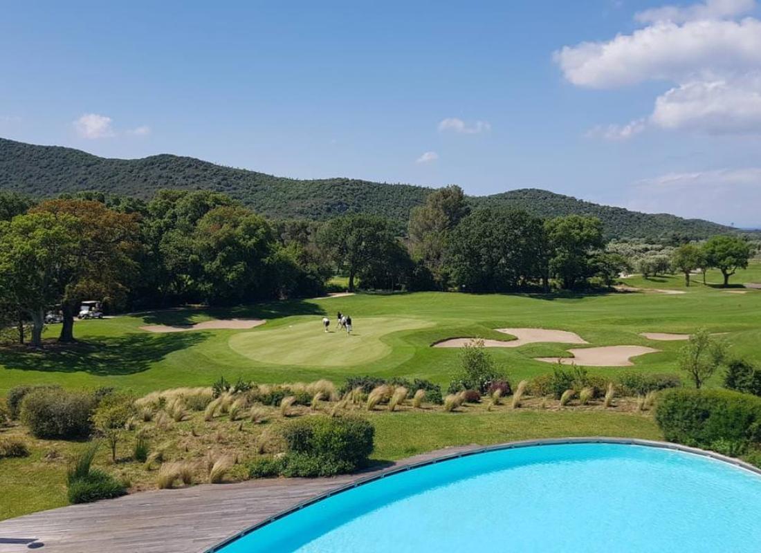 Swimming pool at the Argentario Golf & Wellness Resort with views of the golf course