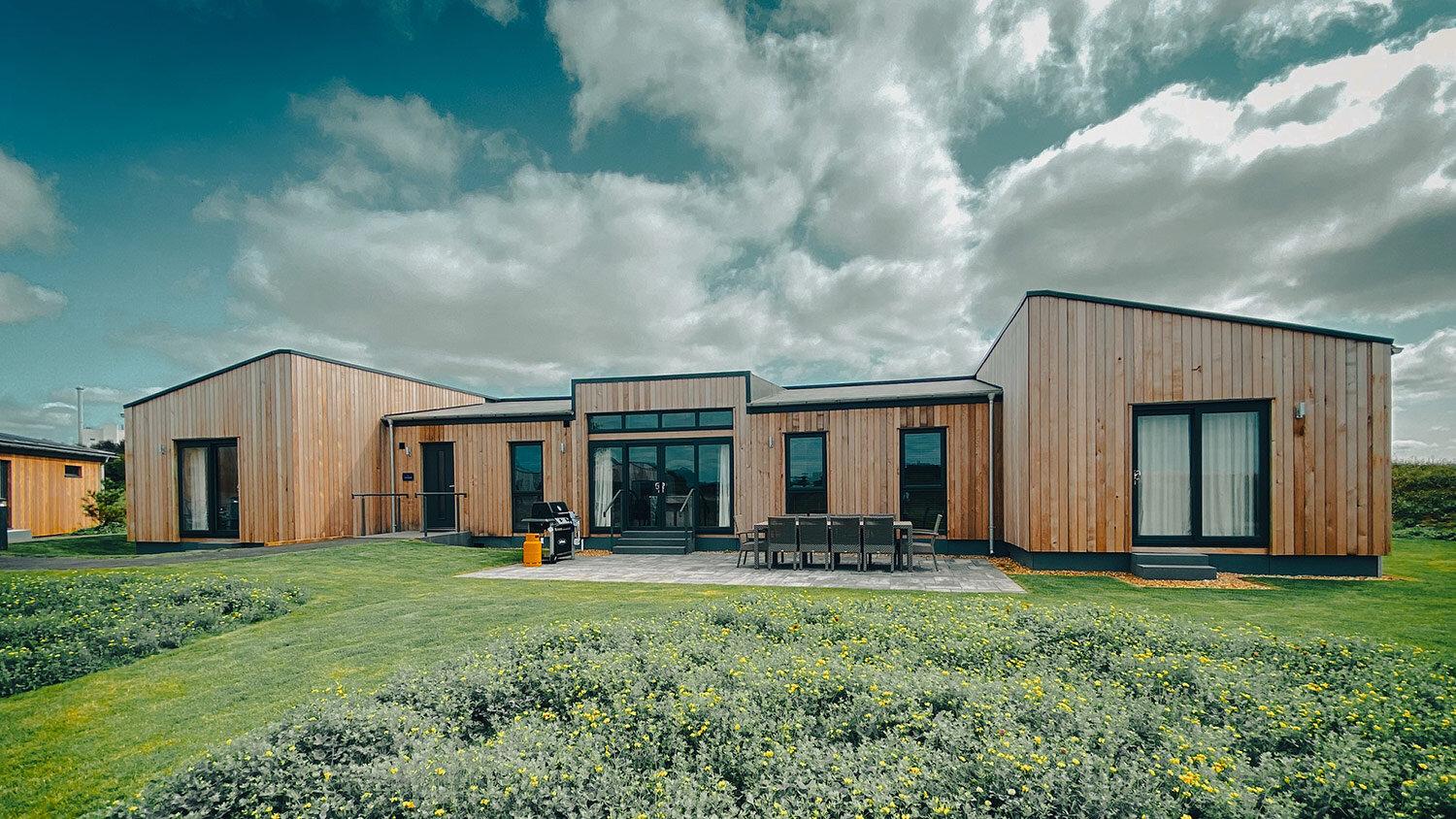 Lodge at the Dundonald Links with outdoor seating area on the patio alongside a bbq