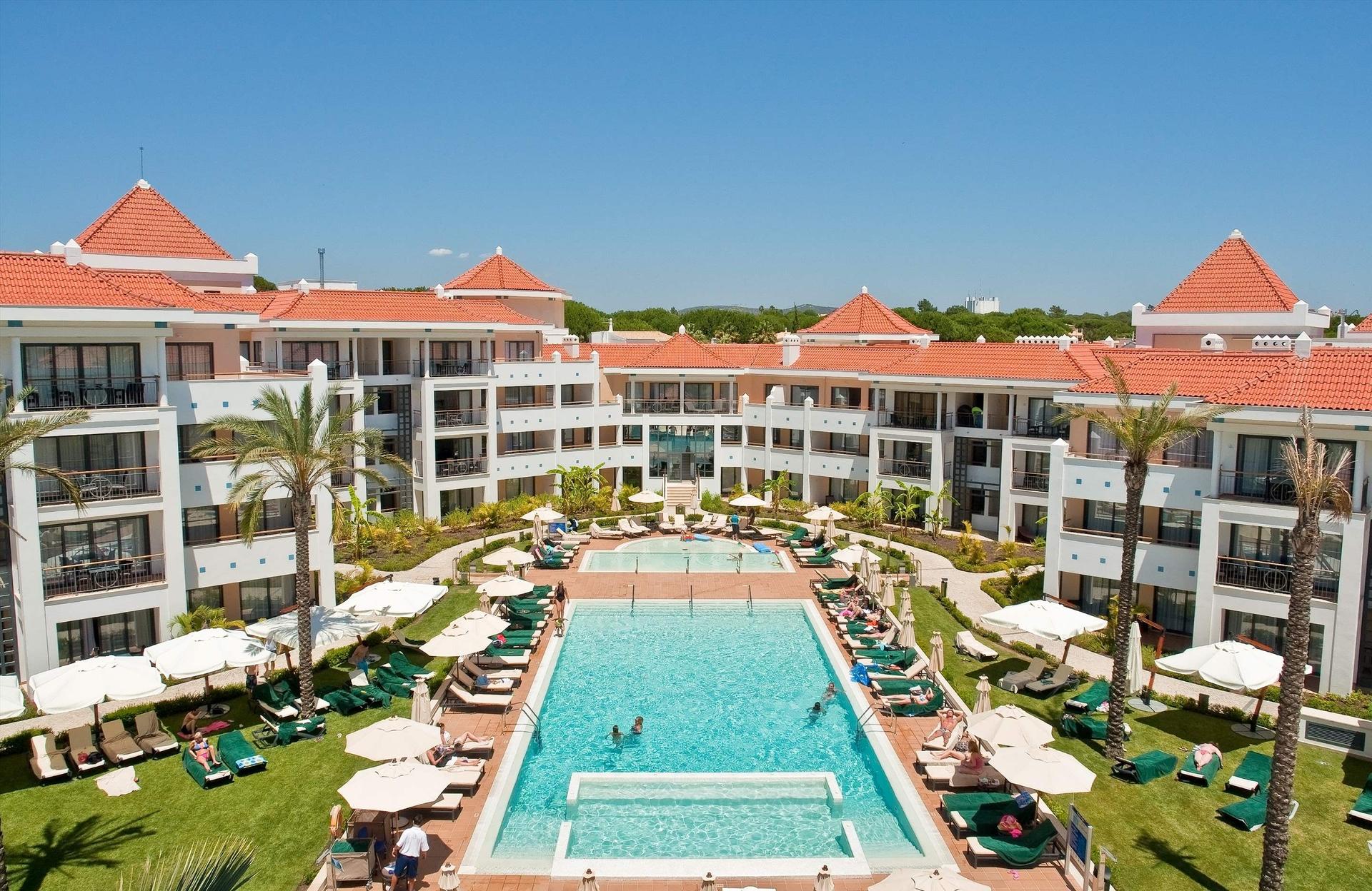 Outdoor swimming pool area of the Hilton Vilamoura As Cascatas