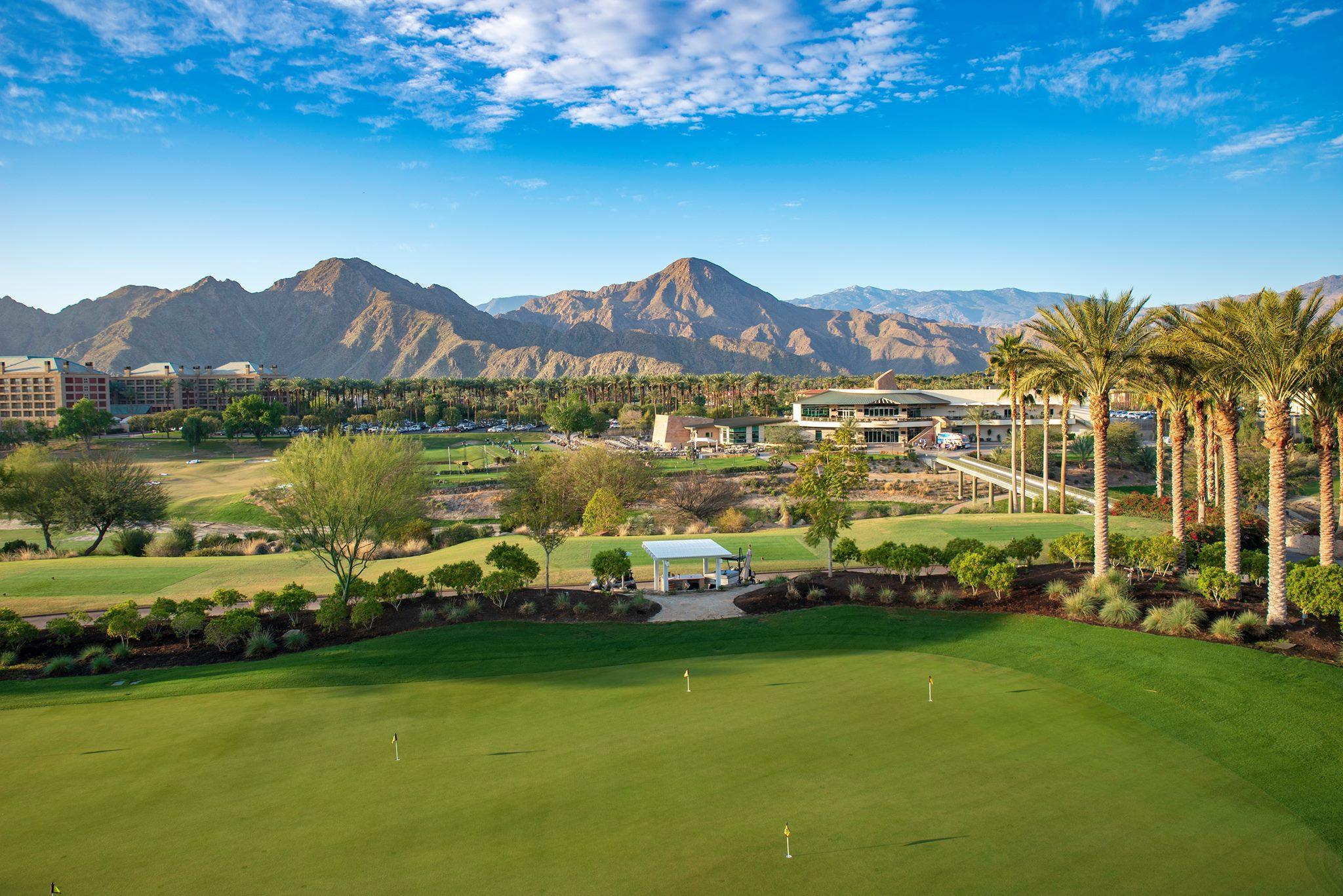 A panoramic view of Indian Wells Golf Resort, showcasing the pristine course layout surrounded by breathtaking desert landscapes.