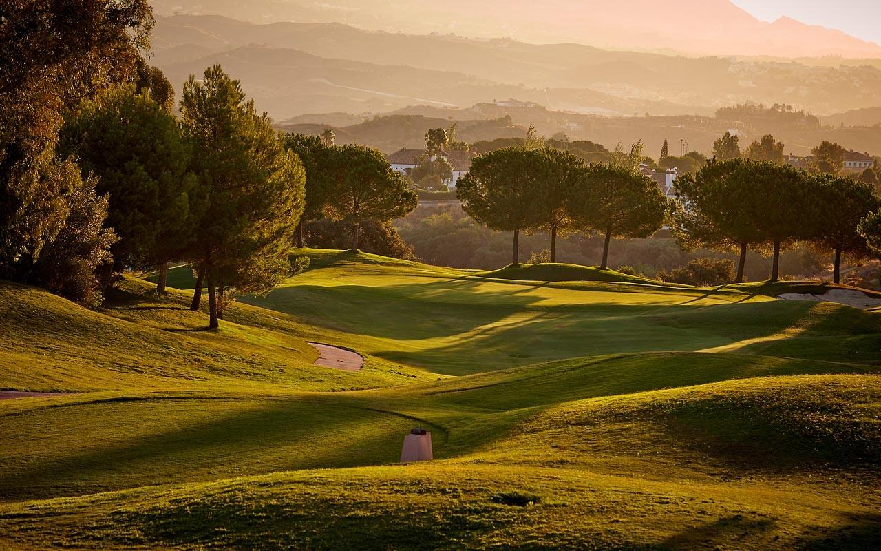 View of a winding fairway at La Cala Golf Resort at dusk