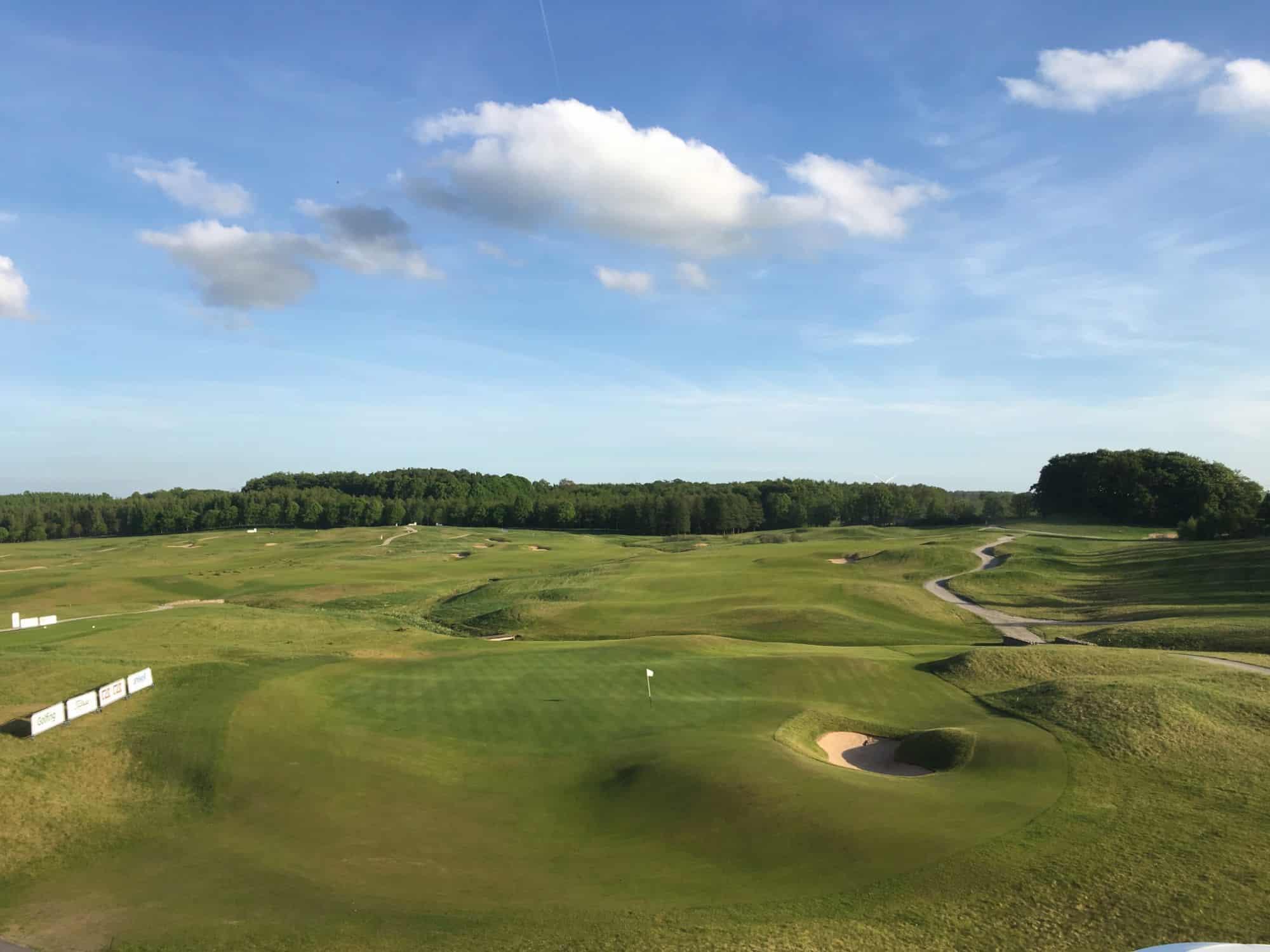 A wide, open course with gently sloping hills and bunkers.