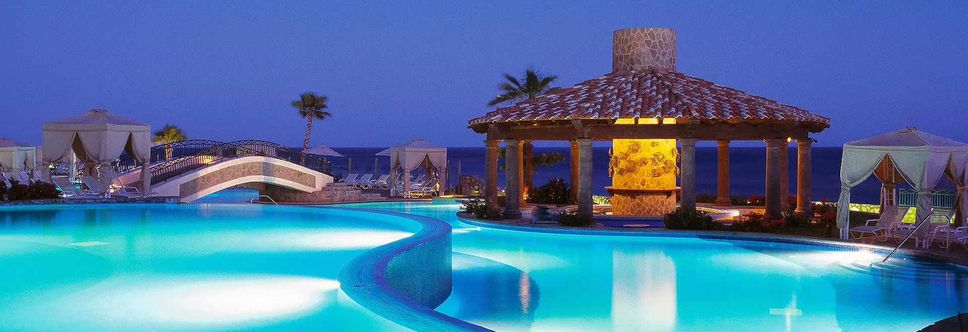 Panoramic view of the outdoor swimming pool with beach views