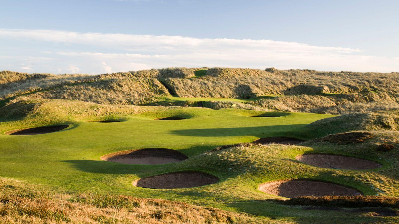 Smooth greens surrounded by sand bunkers and a mature landscape