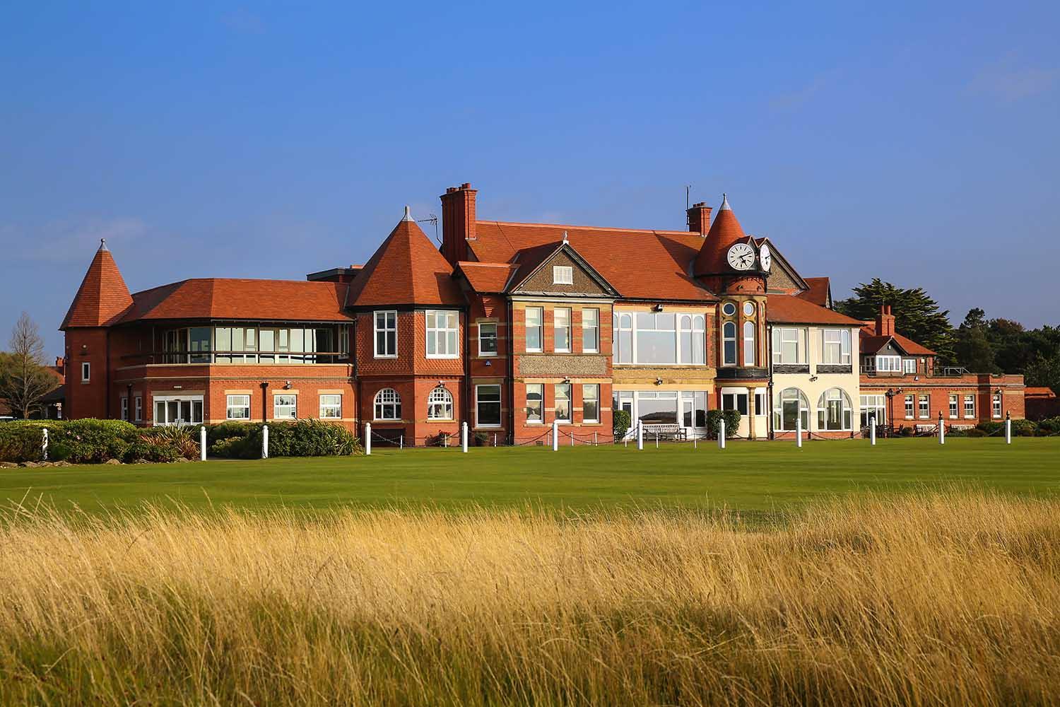 Clubhouse at the Royal Liverpool overlooking the course under blue skies