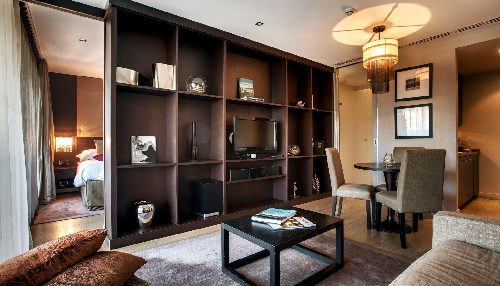 Lounge area leading to a bedroom in the background