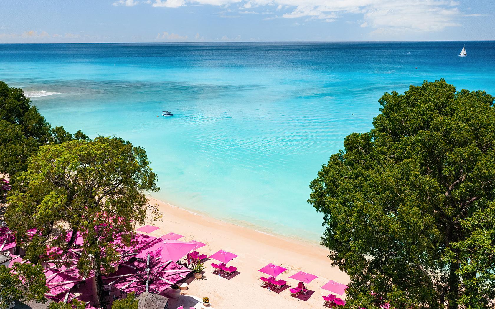 Overhead view of the beach at Sandy lanes with clear blue water