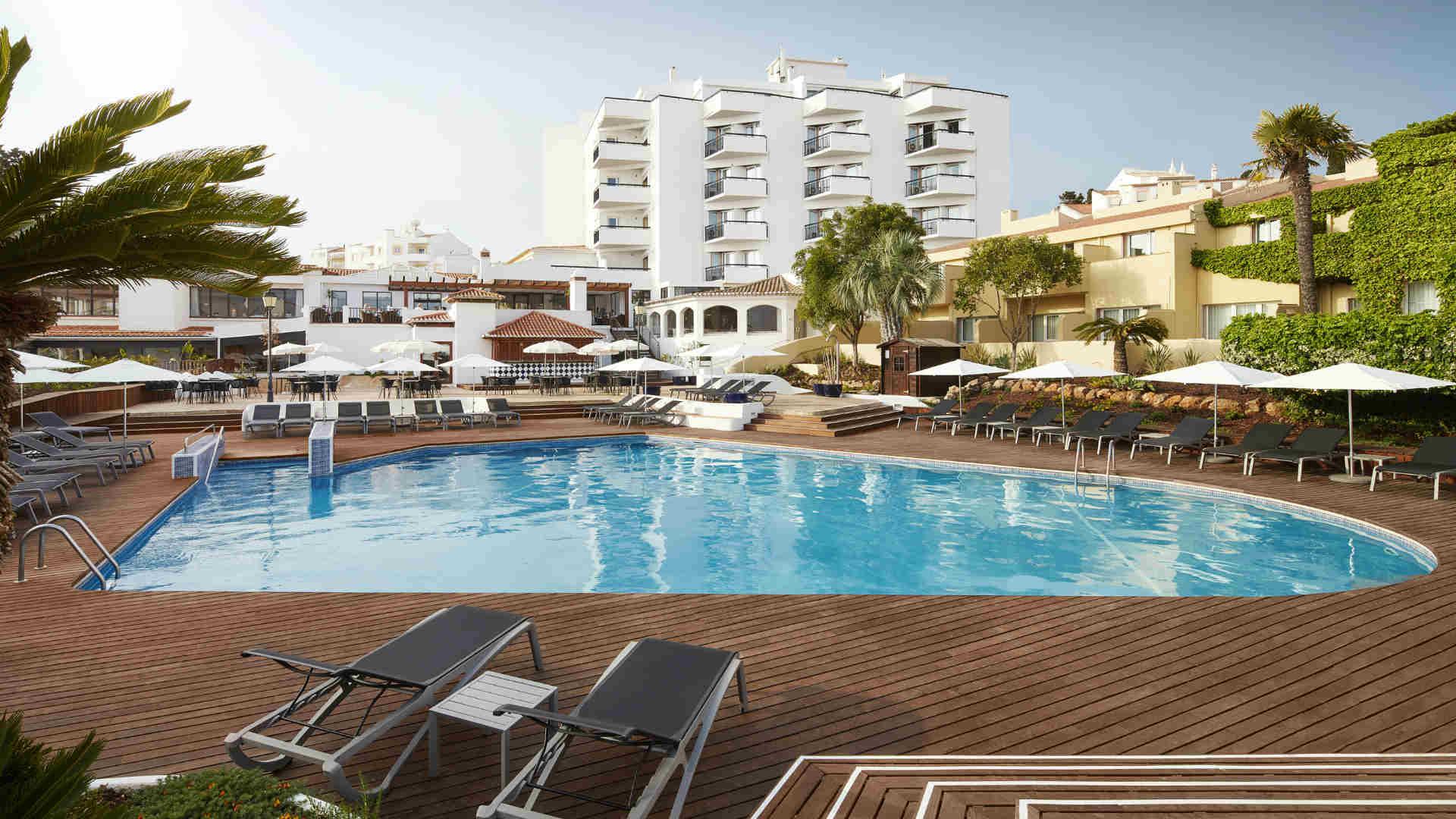 Outdoor swimming pool area with Tivoli Lagos in the background