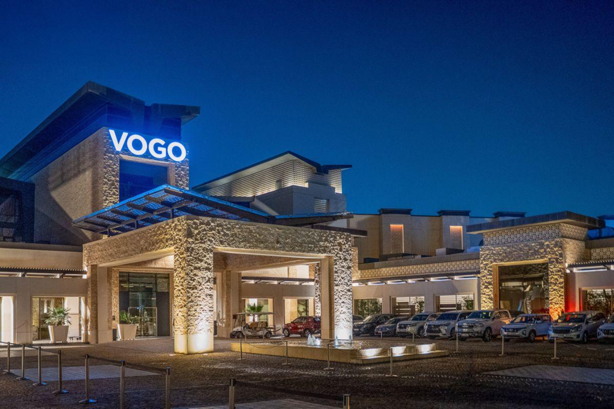 The VOGO sign illuminated on to of the front entrance to the resort