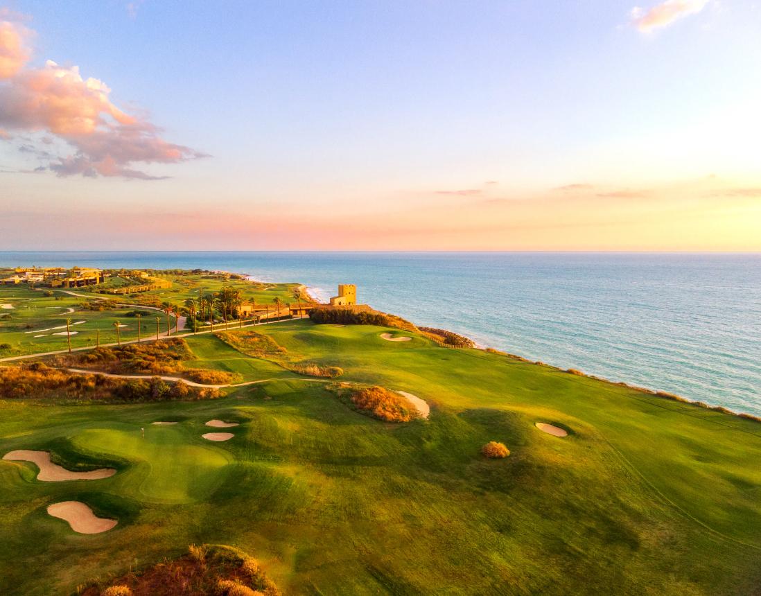 Sun setting over the course causing a golden effect