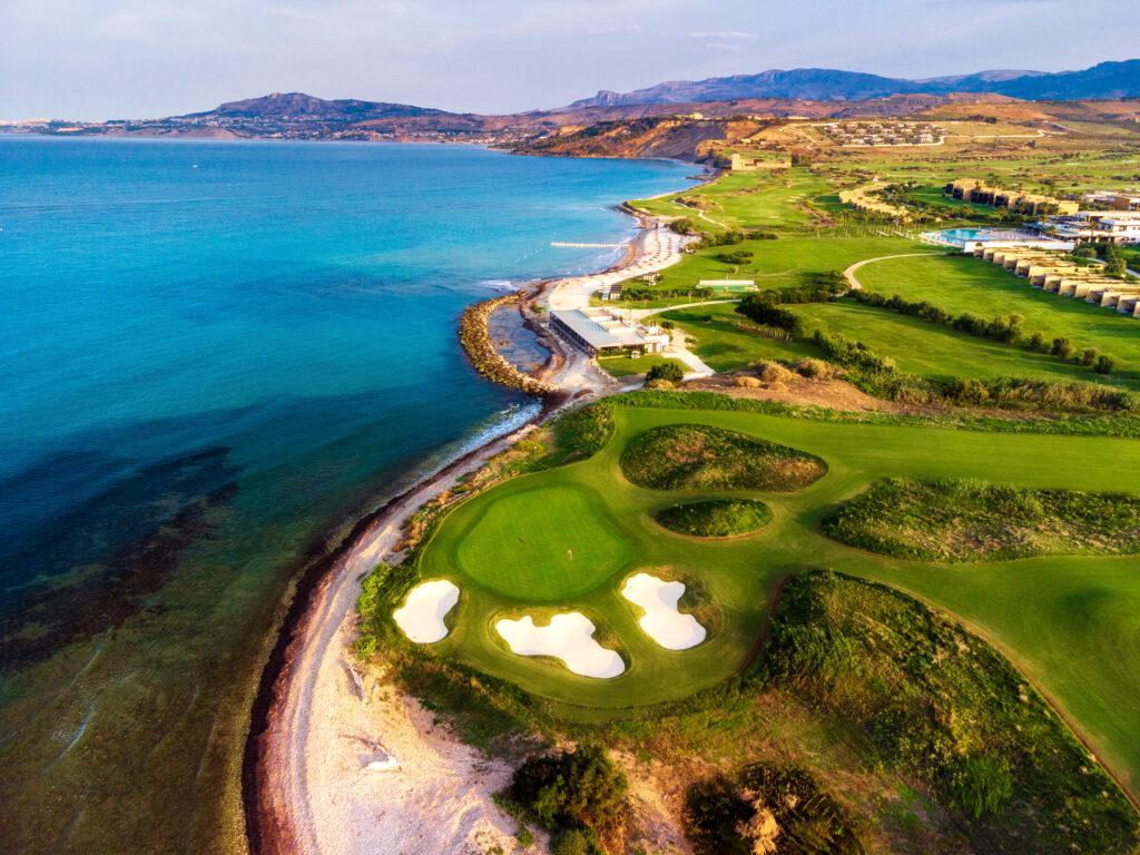 Panoramic view of the resort’s golf course and coastline, showcasing luxury and natural beauty.