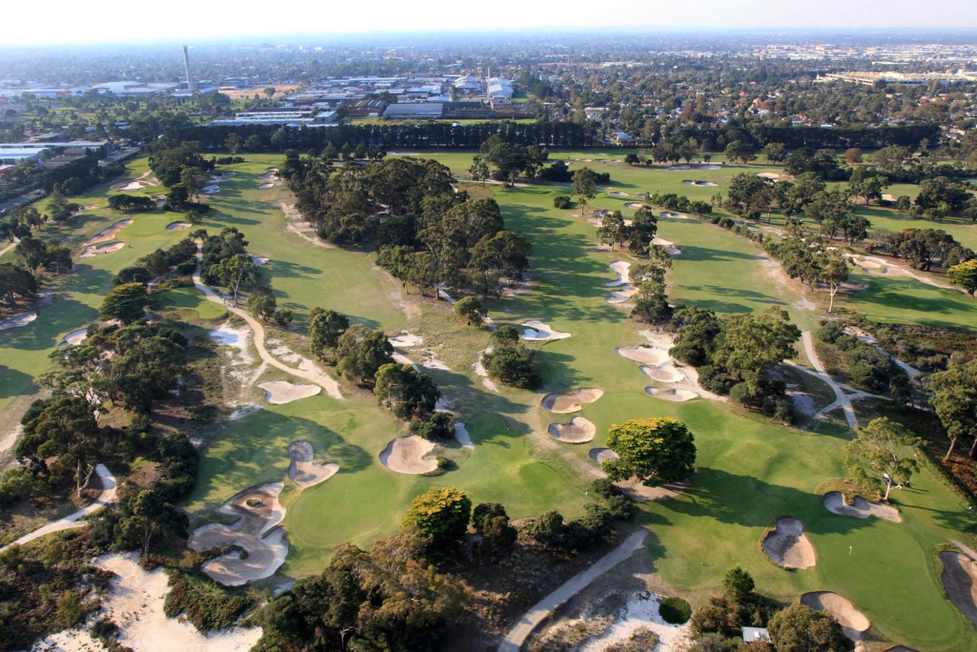 Aerial view of the Victoria Golf Club course with city views in the distance