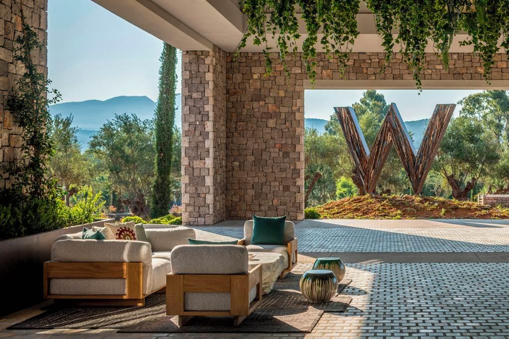 The W hotel sign next to a outdoor seating area