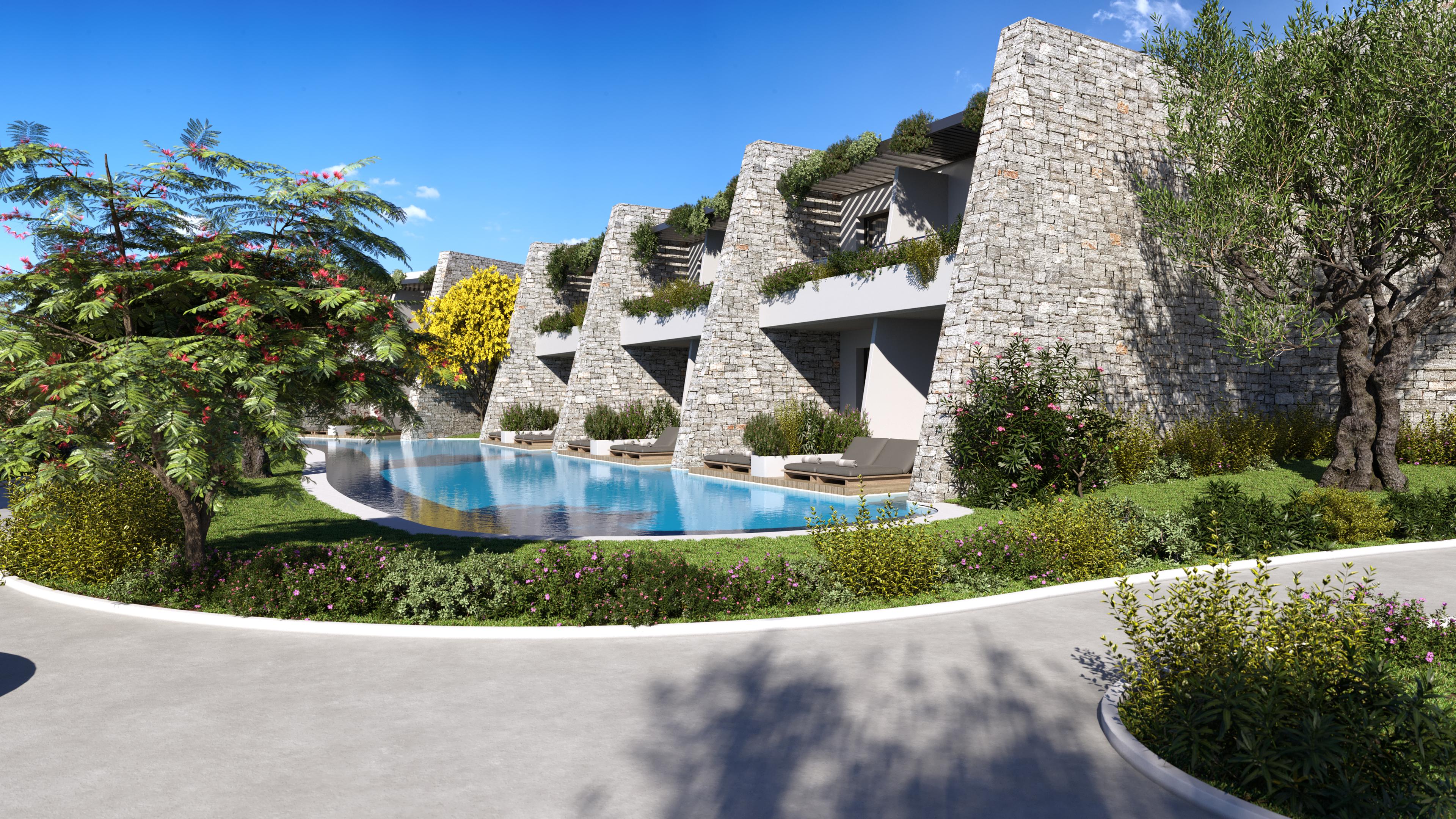 A shared swimming pool for neighbouring villas equipped with two sun beds per