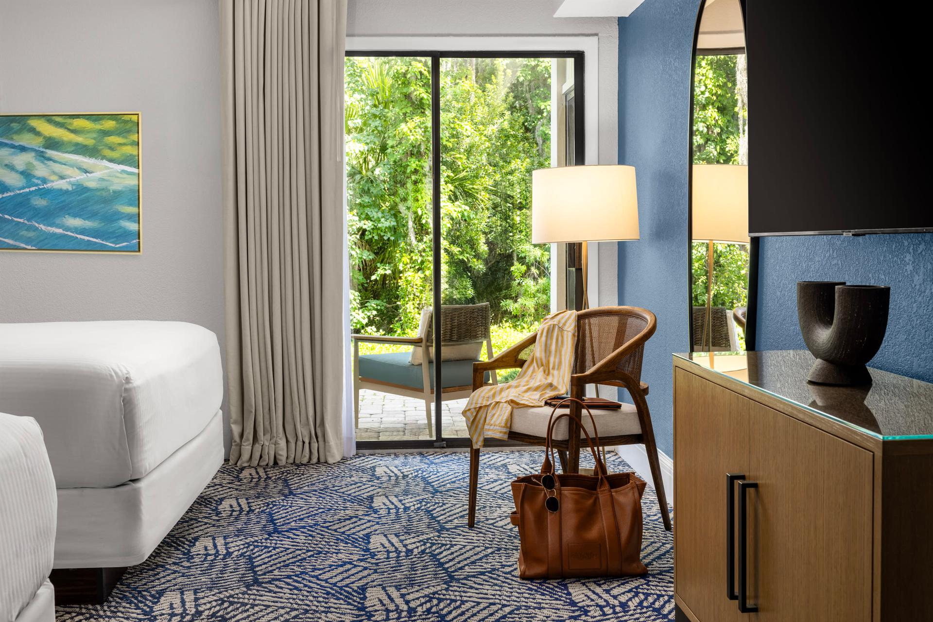 A double bed room leading a patio space