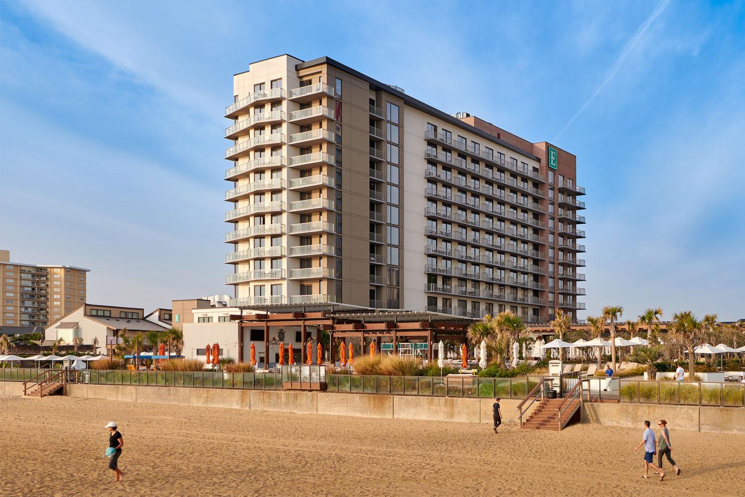 Panoramic view of the Embassy Suites Myrtle Beach - Oceanfront Resort towering over the beach