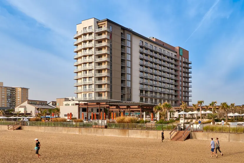 Panoramic view of the Embassy Suites Myrtle Beach - Oceanfront Resort towering over the beach