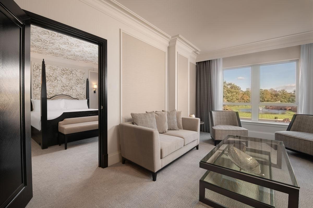 Double bed suite leading into a sitting room as part of the resort with window for natural light