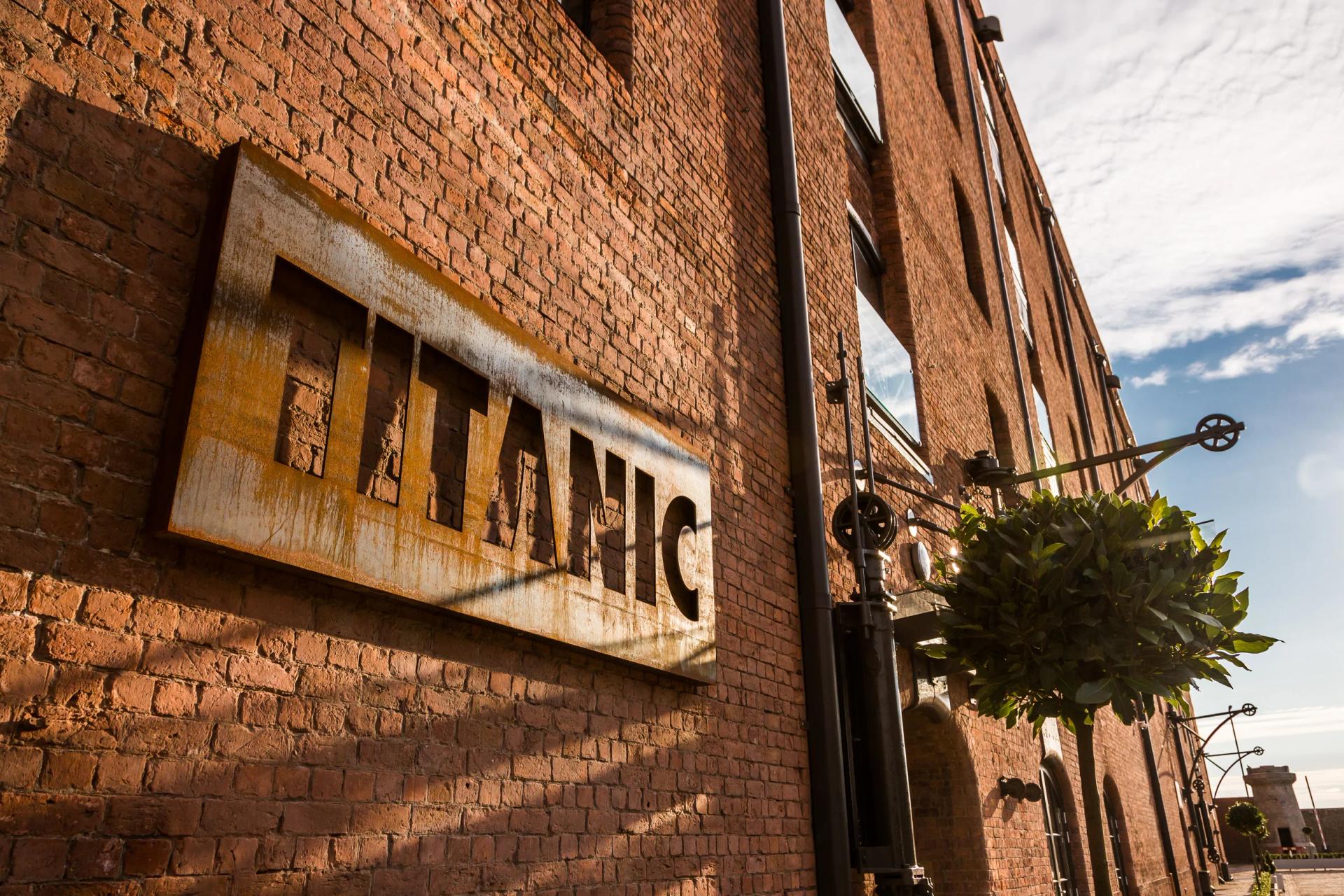 Exterior view of the Titanic Hotel Liverpool sign on the front of the building