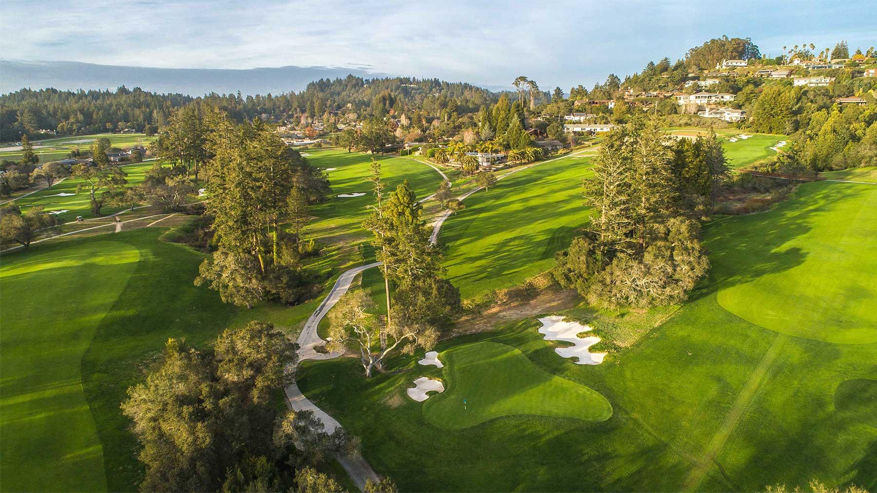Overhead view of a smooth green surrounded by sand bunkers at Pasatiempo Golf Club