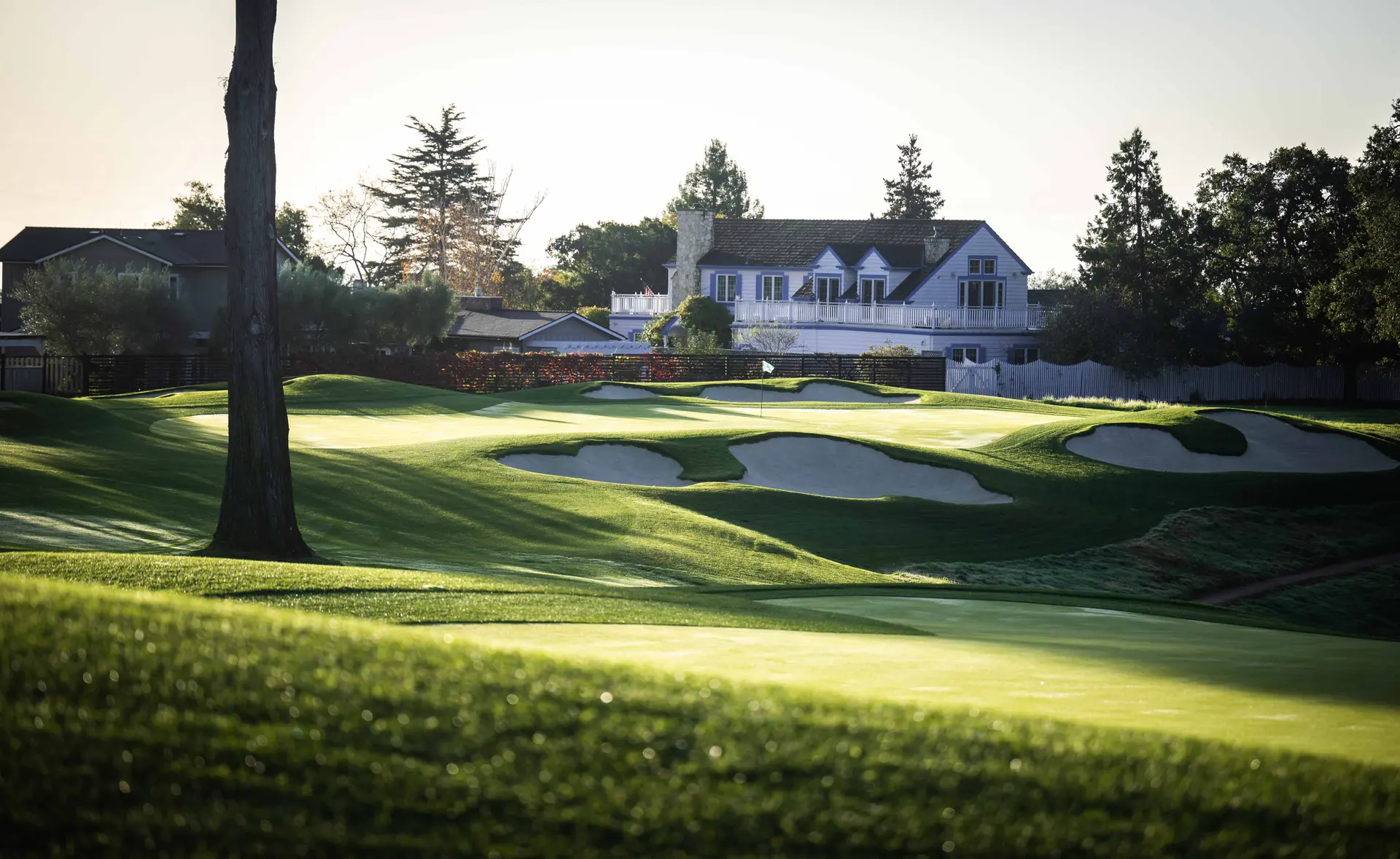 The Pasatiempo Golf Clubhouse overlooking a smooth green on the course